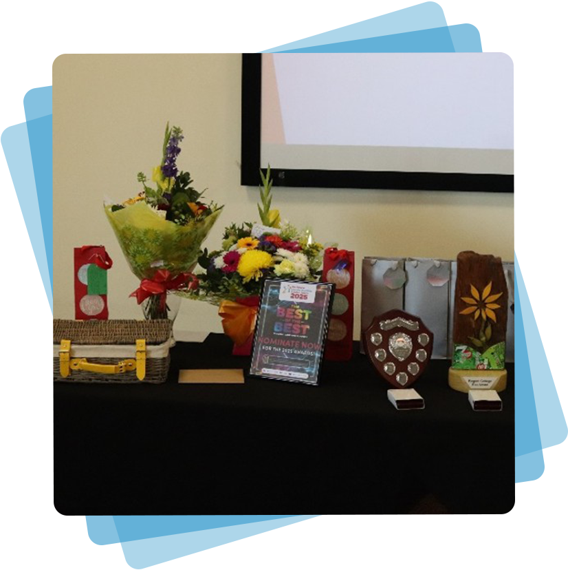 A table with awards and florals